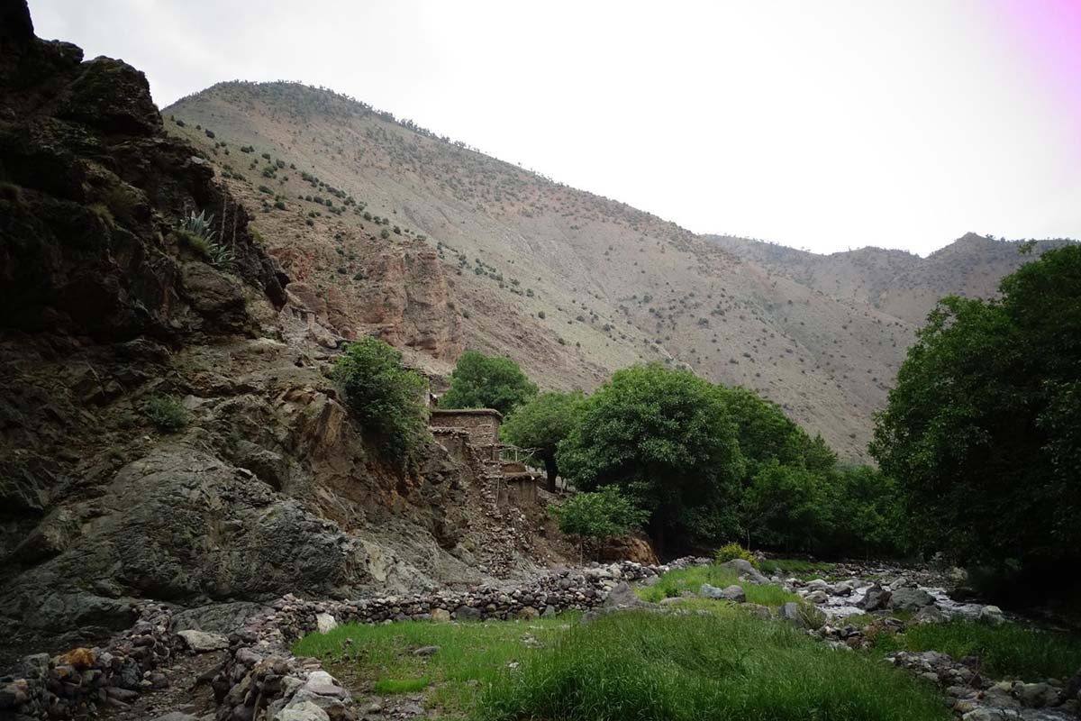 River, trees and mountain trail in Azzaden Valley
