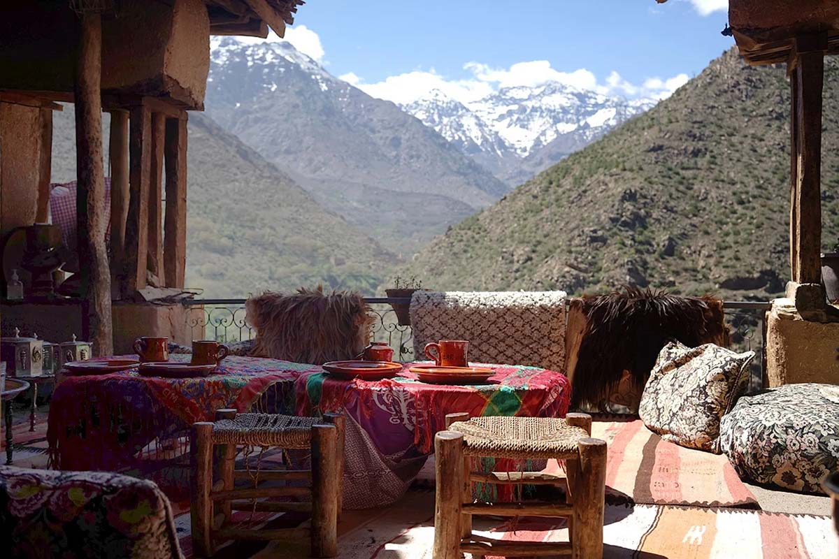 Traditional mountain lodge terrace overlooking the snow-capped High Atlas Mountains near Imlil