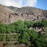 Mountain village surrounded by green orchards in Azzaden Valley