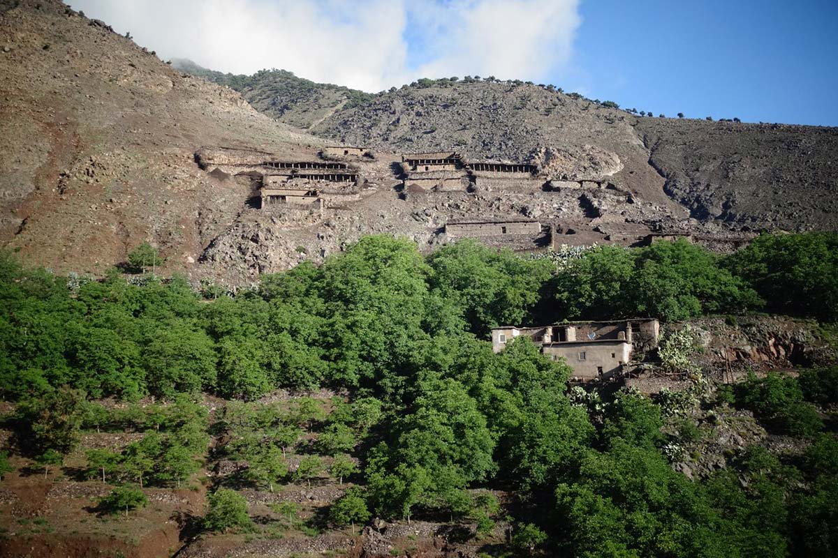 Mountain village surrounded by green orchards in Azzaden Valley