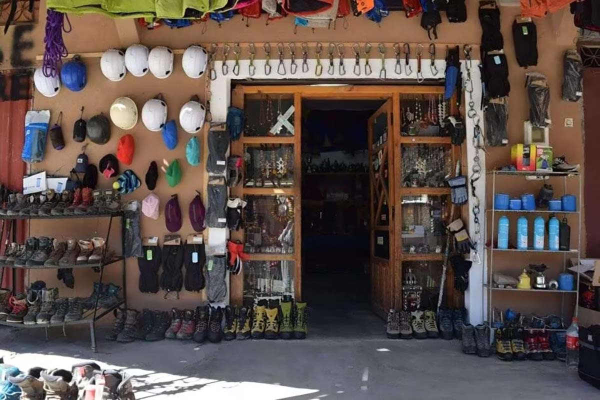 Trekking equipment shop in Imlil with boots, helmets, crampons and mountain gear